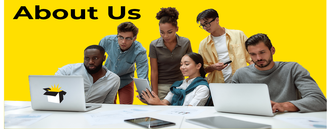 Group of people gathered at a table looking at electronic devices
